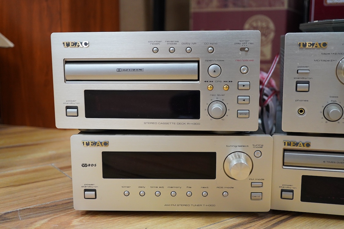 A TEAC four part Hi-Fi system with Celestrion F30 floor standing speakers, comprising a PD-H300C CD Player, a T-H300 AM/FM Tuner, an A-H300 integrated stereo amplifier, and a R-H300 stereo cassette deck, plus a remote co